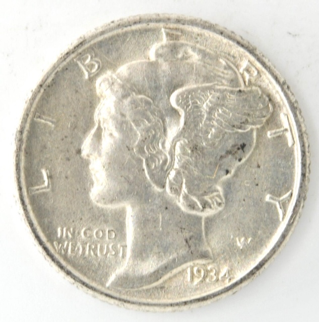 1934 Mercury dime broadstrike error showing expanded diameter and flattened reeded edge compared to a normal example