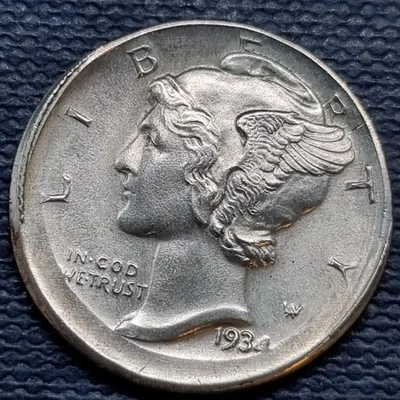 1934 Mercury dime off-center strike error showing design elements shifted off-center with blank planchet visible on one side
